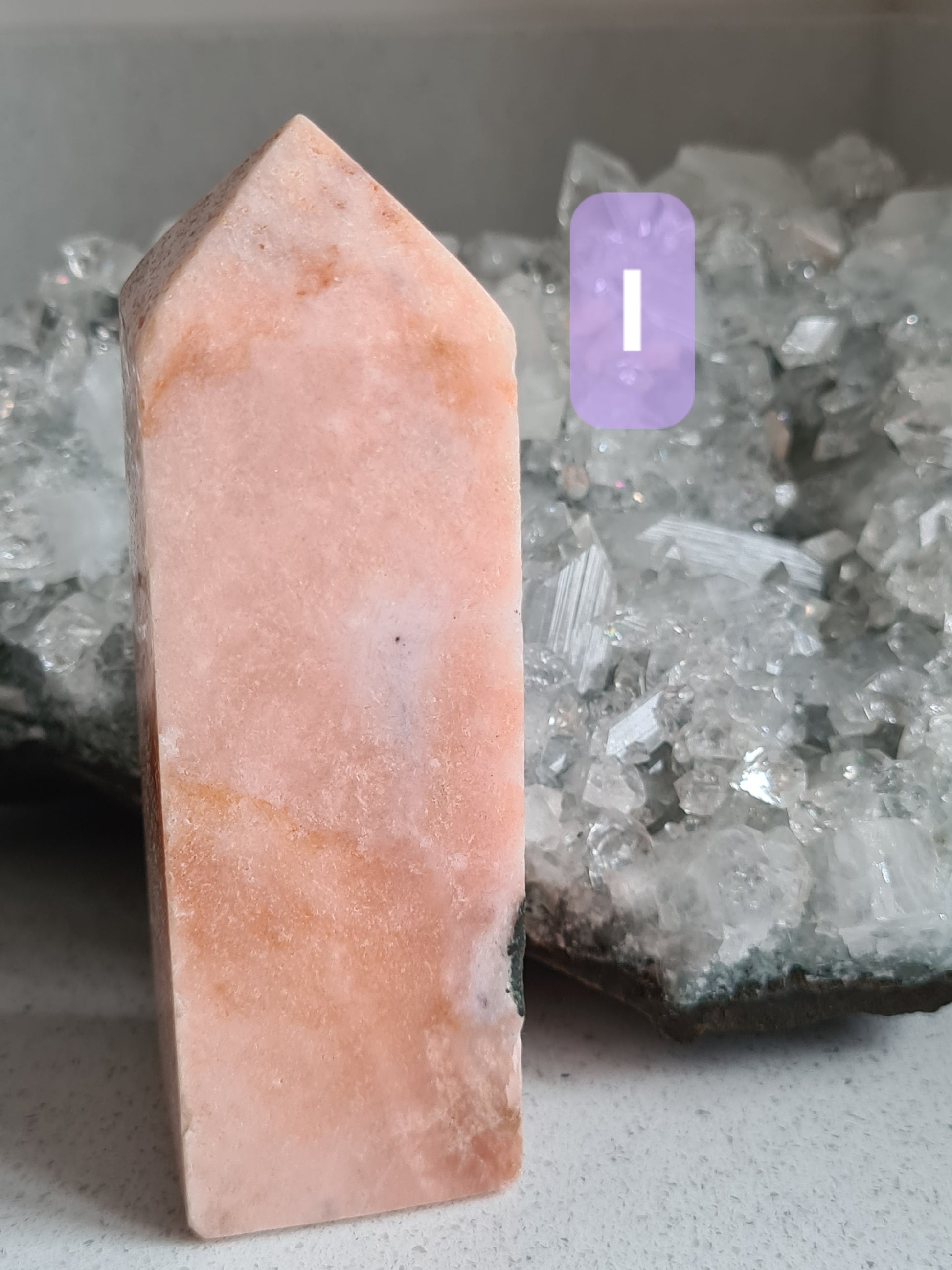 Natural Pink Amethyst Obelisk with Pink Chalcedony from Brail. Photographed with an apophyllite cluster background