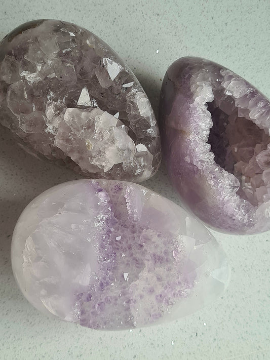 Three Amethyst Cluster Eggs from India,  each with unique colour and structure. Raw and beautiful some have moss agate to the reverse.