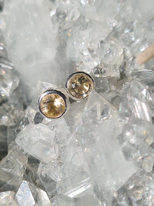 A pair of faceted round natural citrine stud earrings in sterling silver