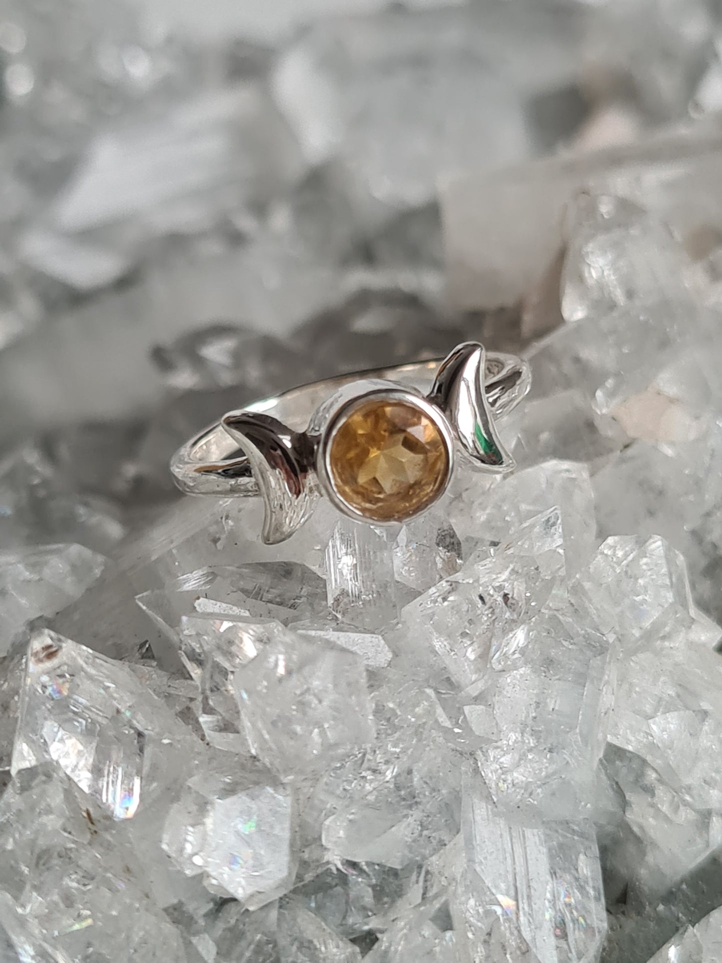 A Triple Moon head ring, rubover set with a round faceted natural citrine in Sterling Silver. Size UK J