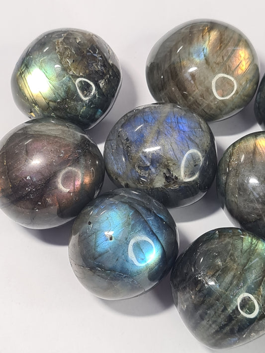Flashy Labradorite Tumbles from Madagascar, colours of Blue, Aqua, Yellow and Purple (not guaranteed in all tumbles). Three sizes available.