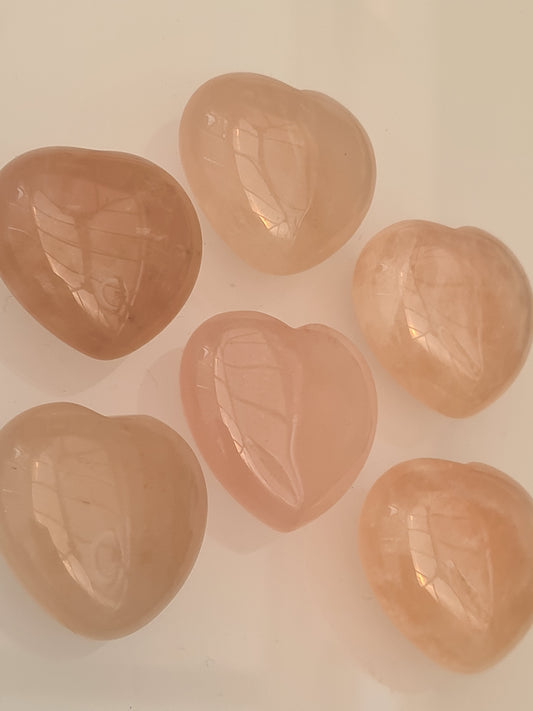 Natural Rose Quartz Polished Hearts, small 3cm size. 6 shown on a white background. 