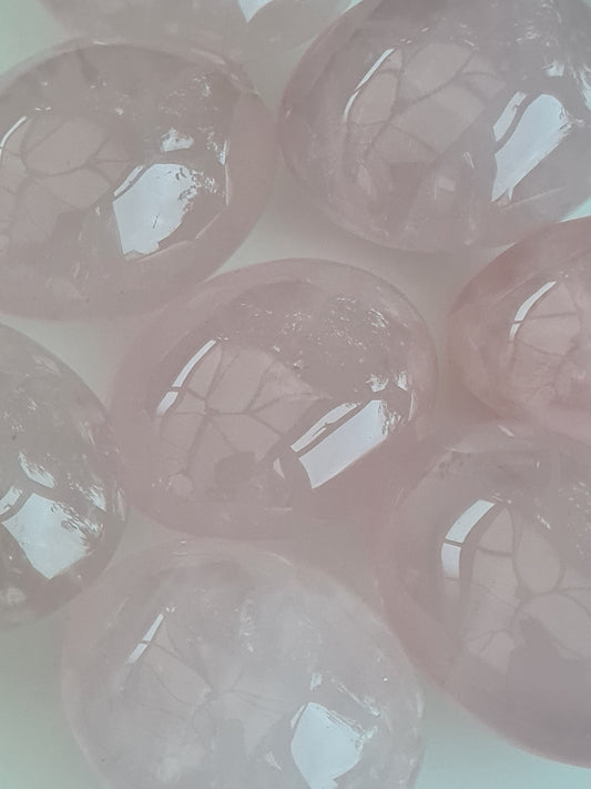 Close up of rose quartz polished Palmstones