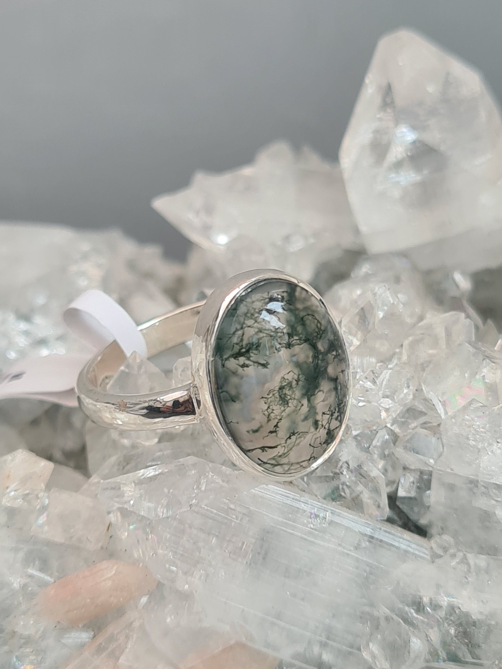 Natural Moss agate set ring in sterling silver. Oval shaped cabochon, rubover set, D-shaped shoulders/shank. UK Size P and half.