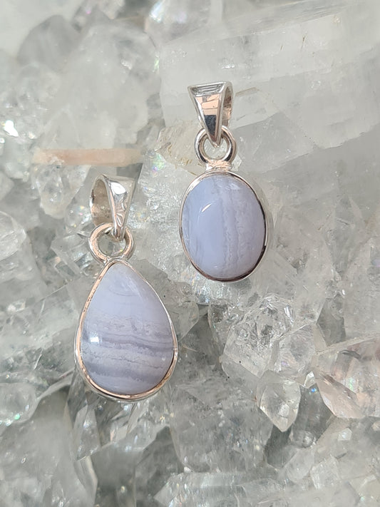Two Natural Blue Lace Agate Set Pendants, 1 pear shaped and 1 oval shaped. In sterling silver.