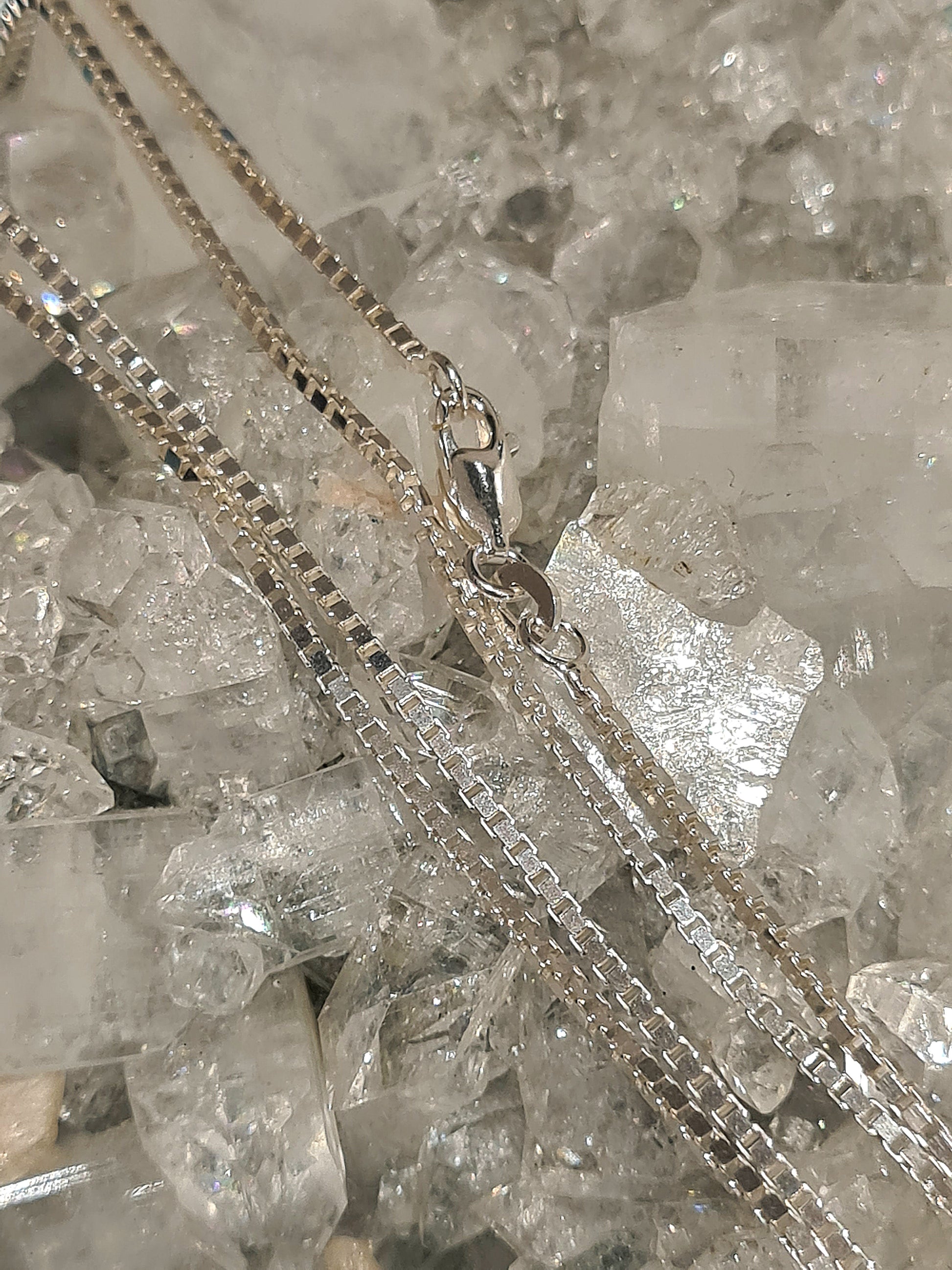 Sterling Silver Venetian Box Chain with Lobster Clasp, measuring 19 inches in length.
Photographed on a raw apophyllite crystal. 
