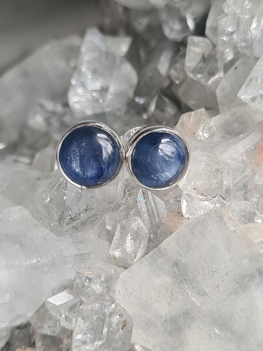 Natural blue kyanite crystal earrings in sterling silver. Available with round or oval cabochons.