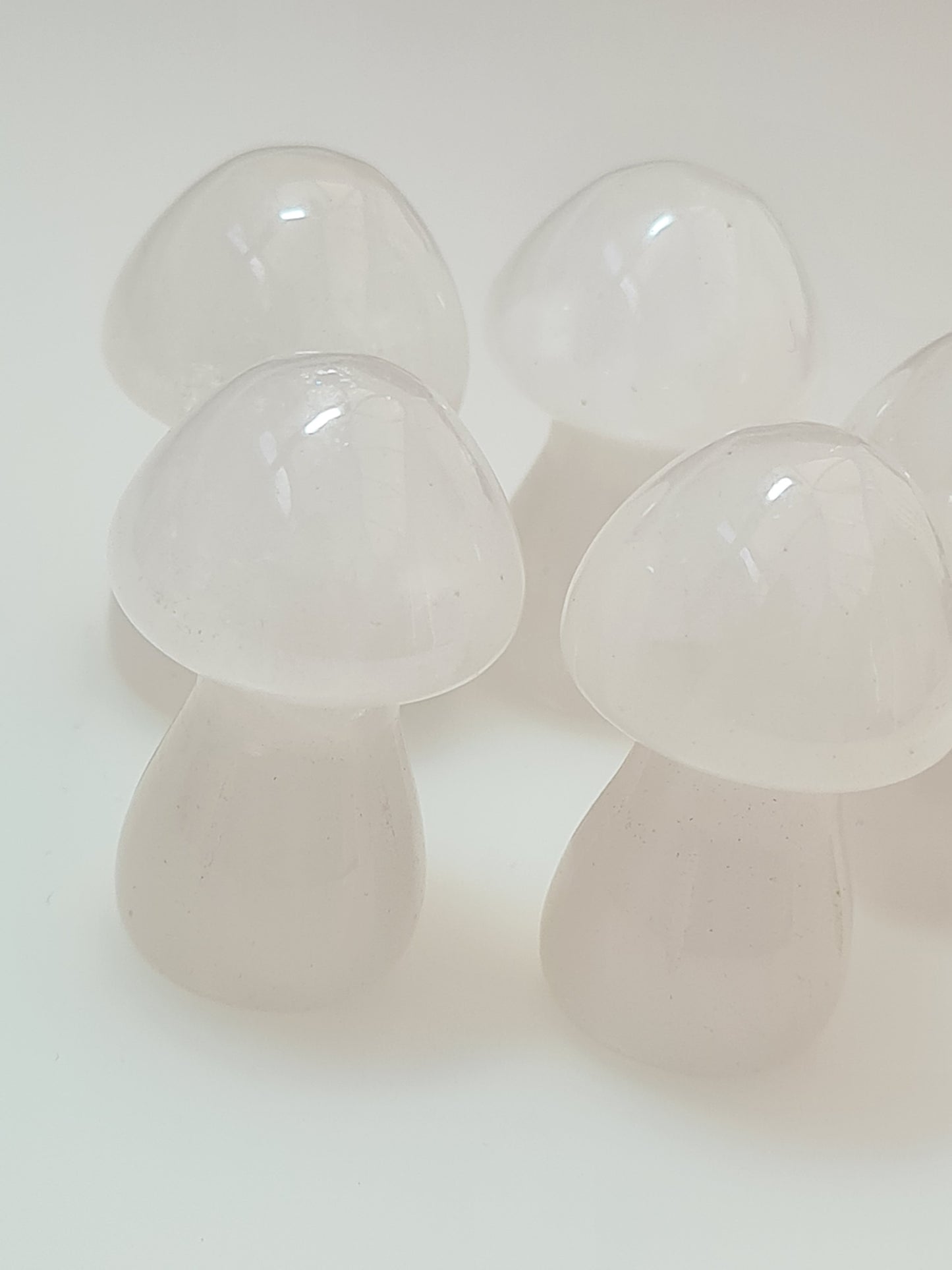 White/Clear Quartz 3.5cm Mushroom Carvings. Four shown on a white background  