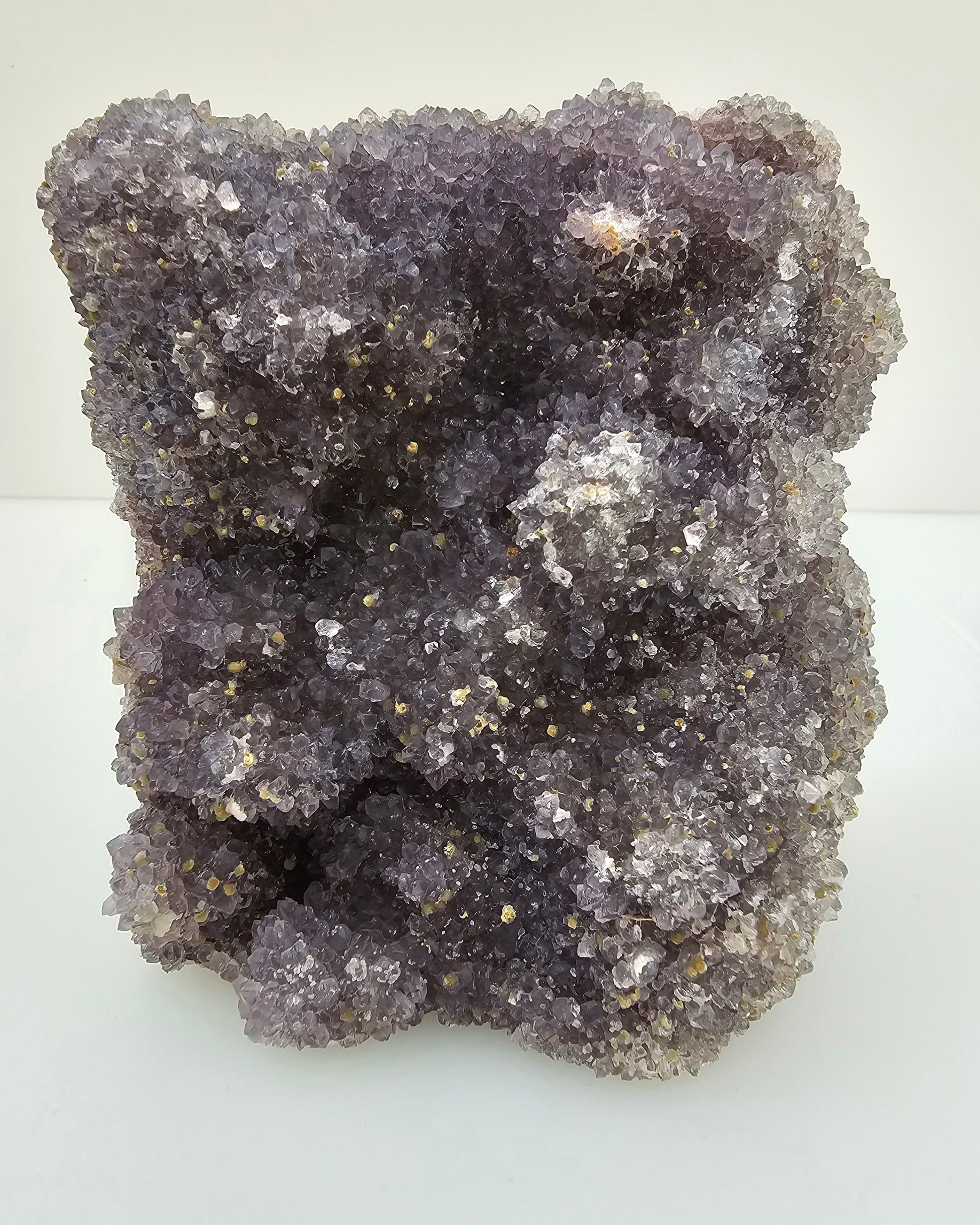 Unusual Botroydial Form Amethyst Crystal Cluster, grey to purple coloured points.
Photographed on a white background. 