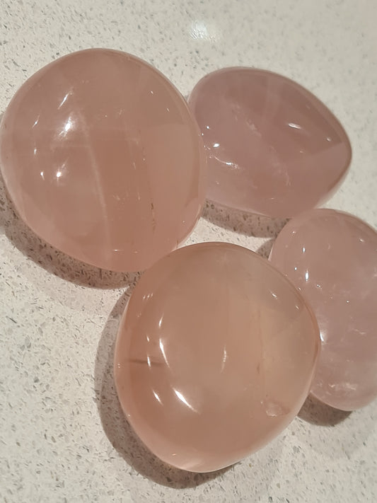 Close up photograph of juicy pink Madagascan Rose Quartz Pebbles