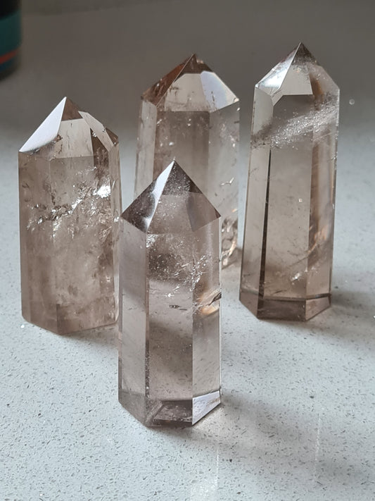Four Brazilian Smoky Quartz Points with great clarity and natural cognac colour