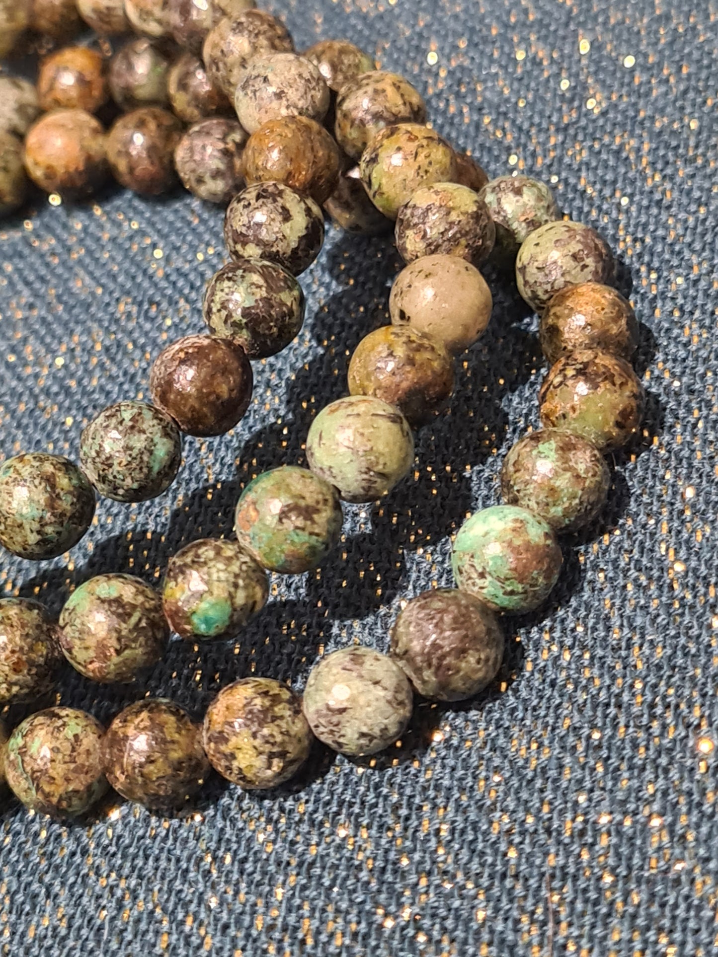 Three Turquoise bead bracelets shown in jasper matrix. 6mm beads.