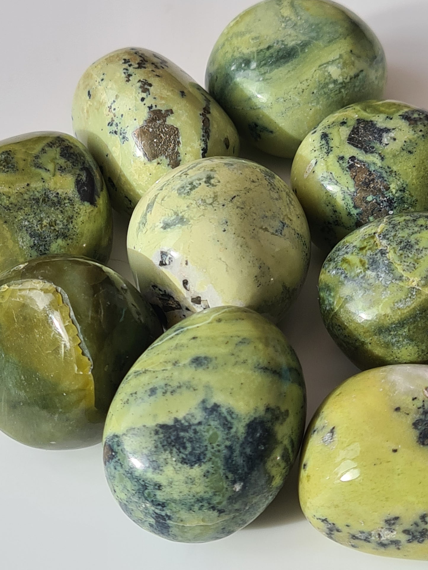 Serpentine Tumblestones in shades of green with black manganese and pyrite inclusions, these weigh approx. 25 to 30 grams.