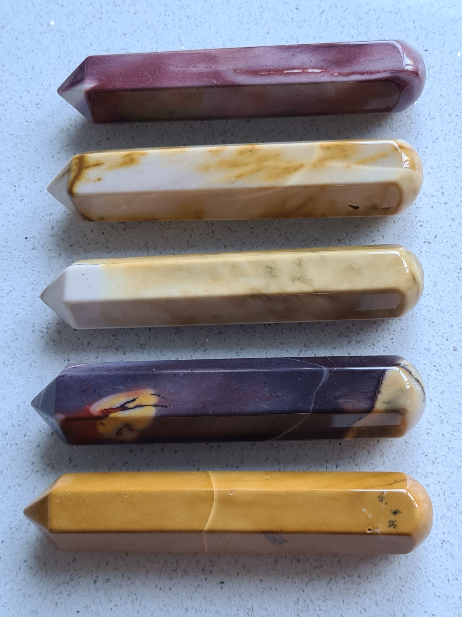 Collection of Natural Mookaite Wands, with one round end and one pointed end, in colours of yellow, vanilla, pink or purple.