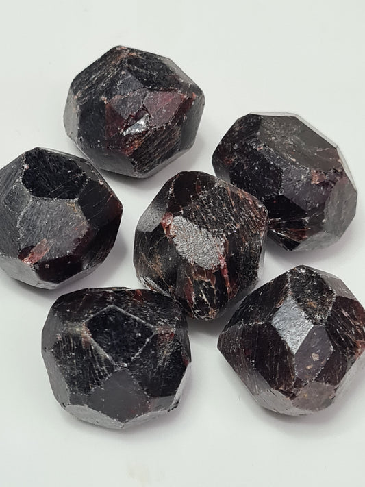 Raw Pyrope/Almandine mix Garnet Dodecahedrons. Dark red colour. Natural form