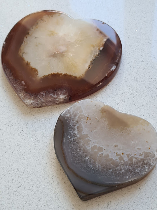 Two Banded Agate Hearts from South Africa. In colours of brown, white, grey and blue.