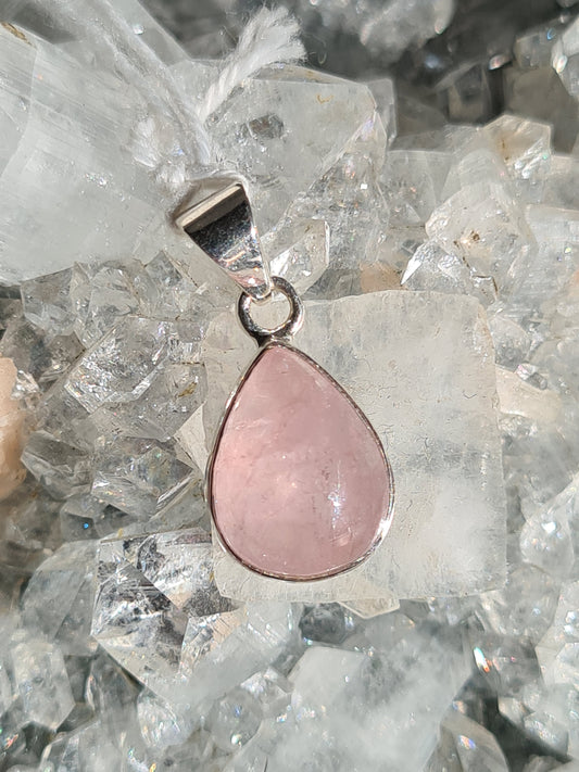 Natural Pink Morganite Pendant in Sterling Silver. This rare form of pink beryl is pear shaped and rubover set into a drop pendant.