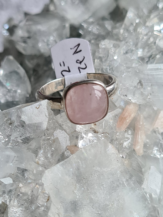 A natural pink morganite, rubover set in sterling silver. The cabochon is cushion shaped. Ring size UK N