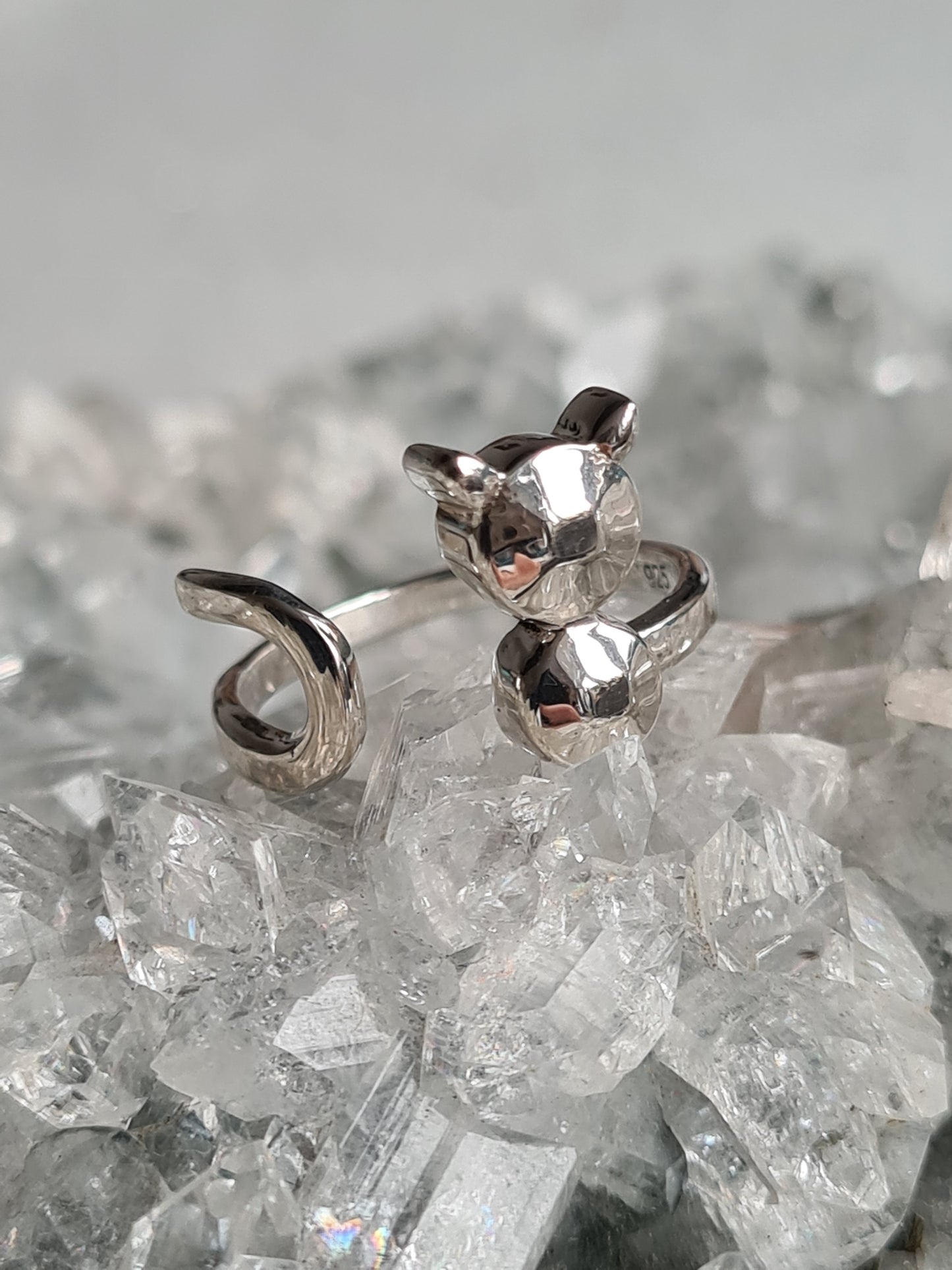 An adjustable Cat ring in sterling silver, with 3-d body and wrap round tail. Sizes M.5 and O available