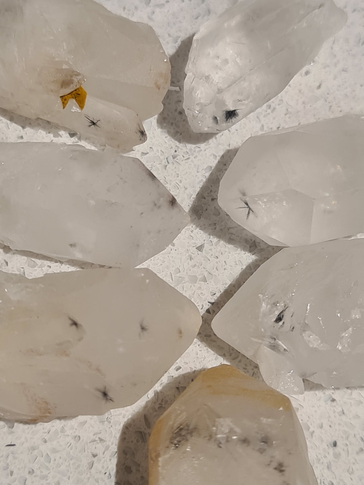 A selection of raw clear quartz points with Hollandite inclusions from Brazil