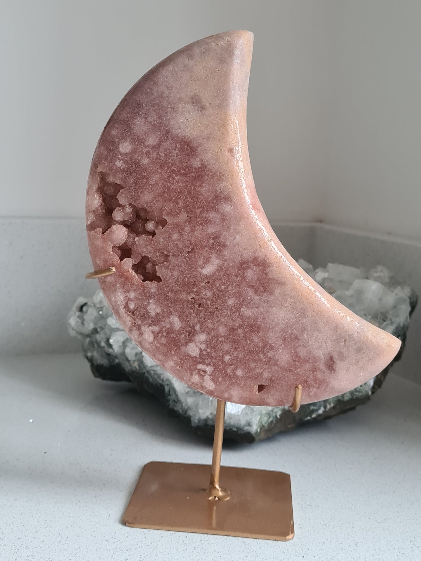 Natural Pink Amethyst Crescent Moon Carving on Rose Gold coloured stand. Stunning druzy botroydial caves and flower patterns. 