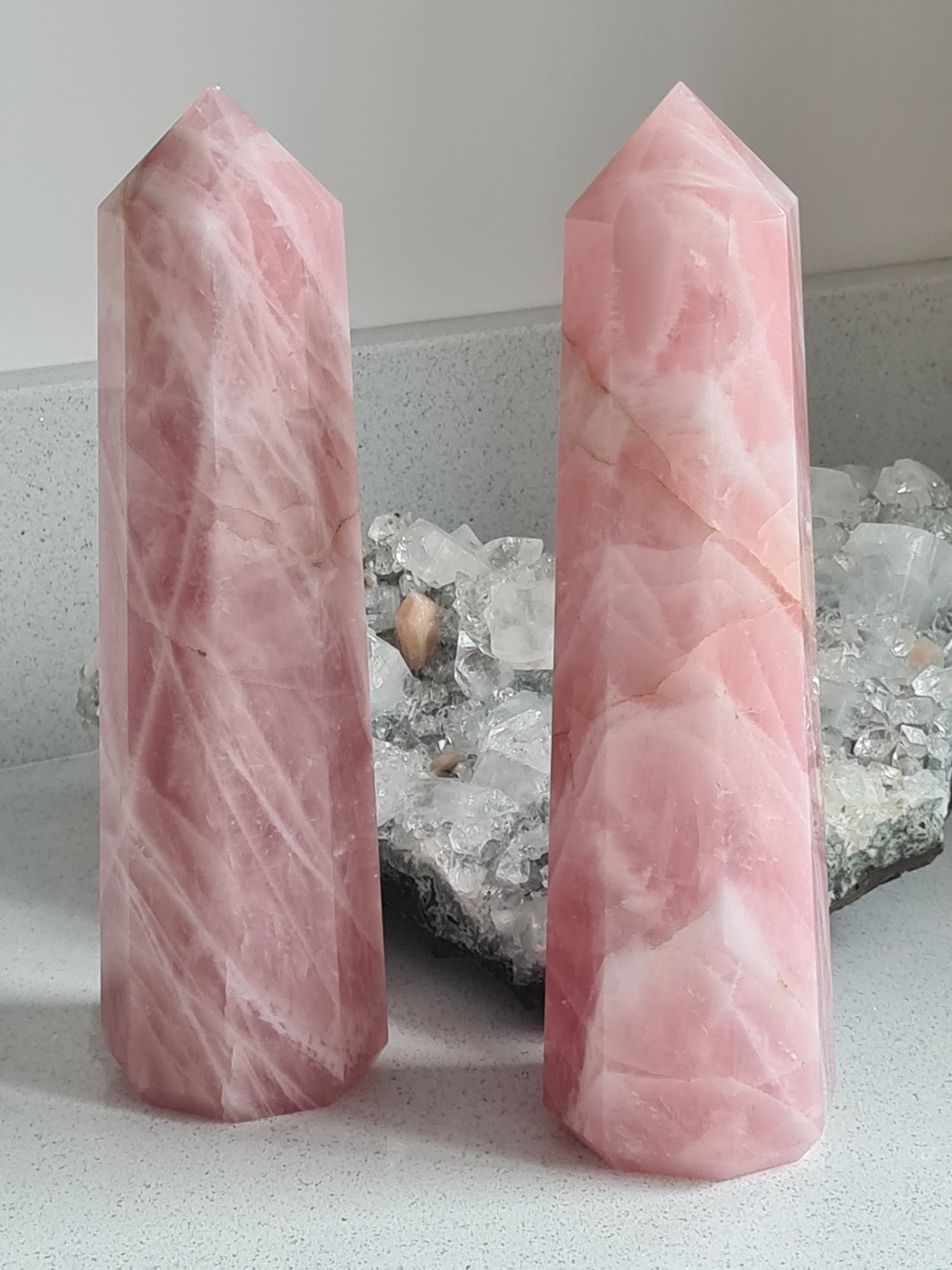 Two statement towers of rose quartz, each measuring 20cm tall