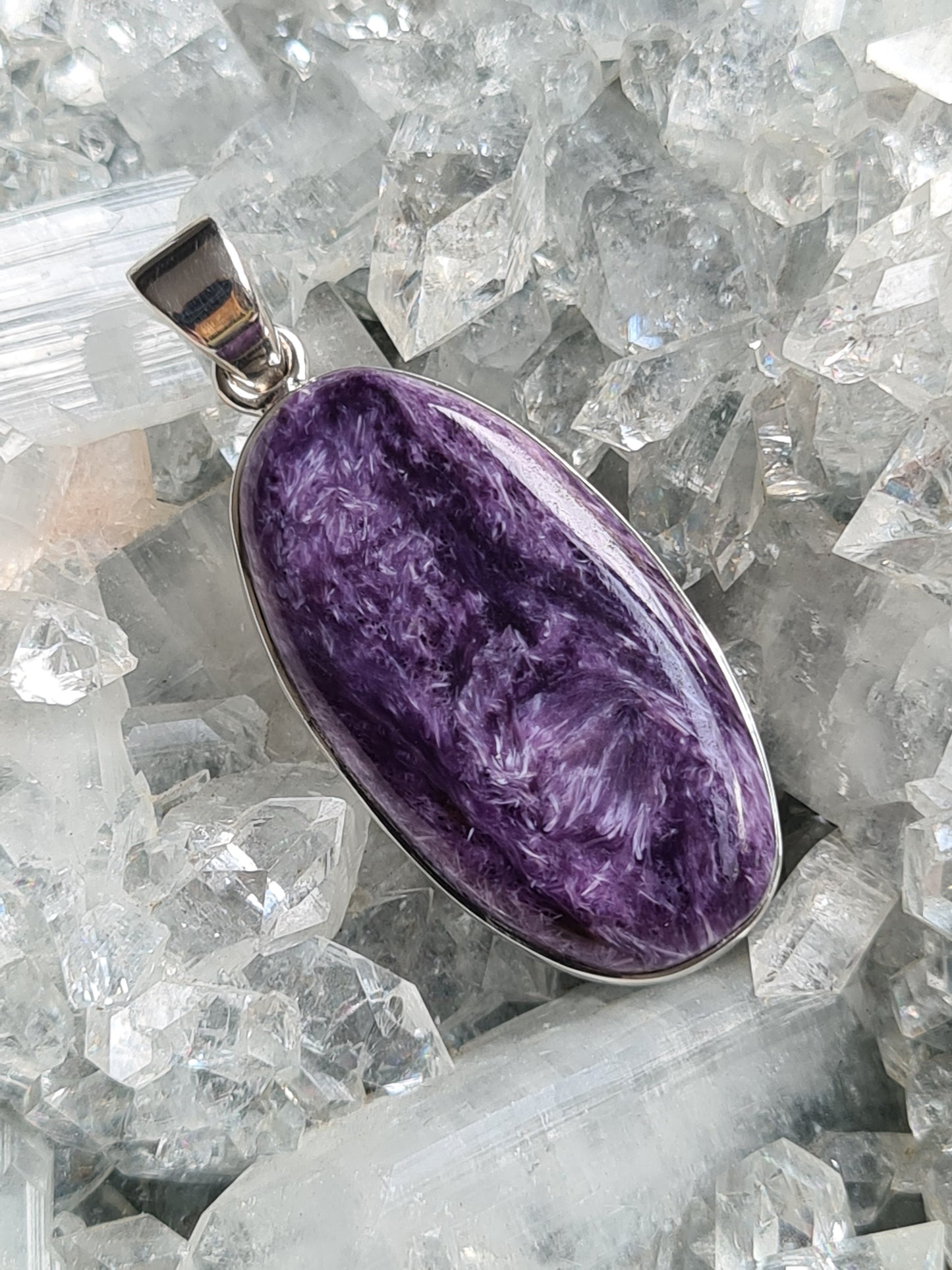 Charoite Pendant - Large oval shaped charoite, rubover set in sterling silver. The swirls and patterns in this purple charoite are mesmerising!
