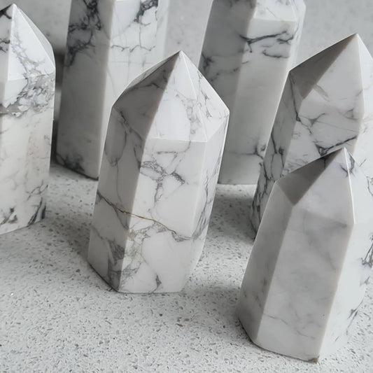 Collection of white howlite points measuring approx. 40mm tall.